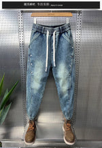 Mens Washed Denim Jeans With A Vintage Design, Featuring Button Detailing And A Tapered Leg